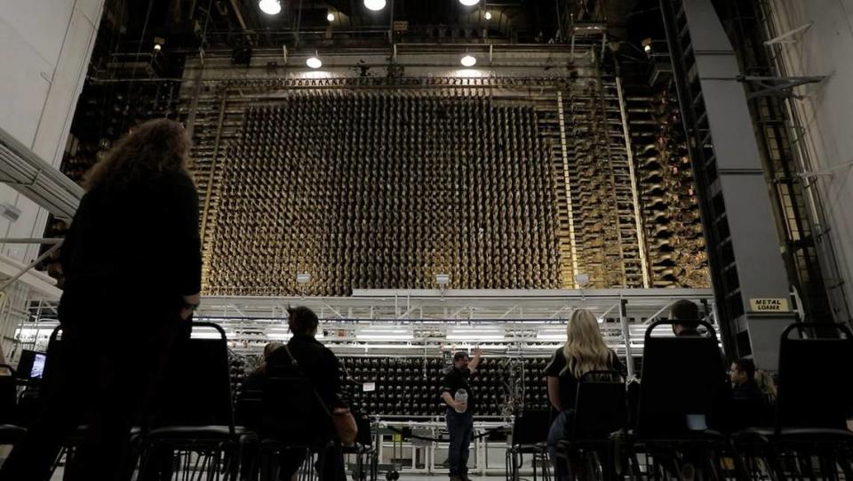 Visitors to Hanford’s B Reactor see the towering front face of the reactor.