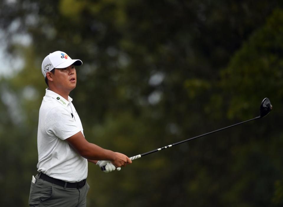 Si Woo Kim hits his tee shot on the seventh hole before play was suspended during the final round of the FedEx St. Jude Championship golf tournament. (Photo: Christopher Hanewinckel-USA TODAY Sports)