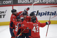 Washington Capitals center Lars Eller (20) celebrates his goal with right wing Tom Wilson (43), left wing Conor Sheary (73), defenseman Justin Schultz (2), and right wing Anthony Mantha (39) during the third period of an NHL hockey game against the Philadelphia Flyers, Saturday, May 8, 2021, in Washington. The Capitals won 2-1 in overtime. (AP Photo/Nick Wass)