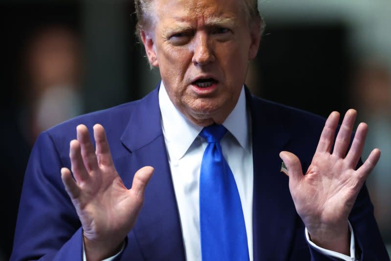 Former President Donald Trump speaks to reporters as he leaves his trial at Manhattan criminal court in New York on Friday. The third week has ended in Trump's criminal trial on charges he allegedly falsified business records to cover up a sex scandal during the 2016 presidential campaign. Pool photo by Charly Triballeau/UPI