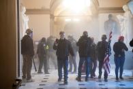 Demonstrators breeched security and entered the Capitol as Congress debated the a 2020 presidential election Electoral Vote Certification. (Photo by SAUL LOEB/AFP via Getty Images)