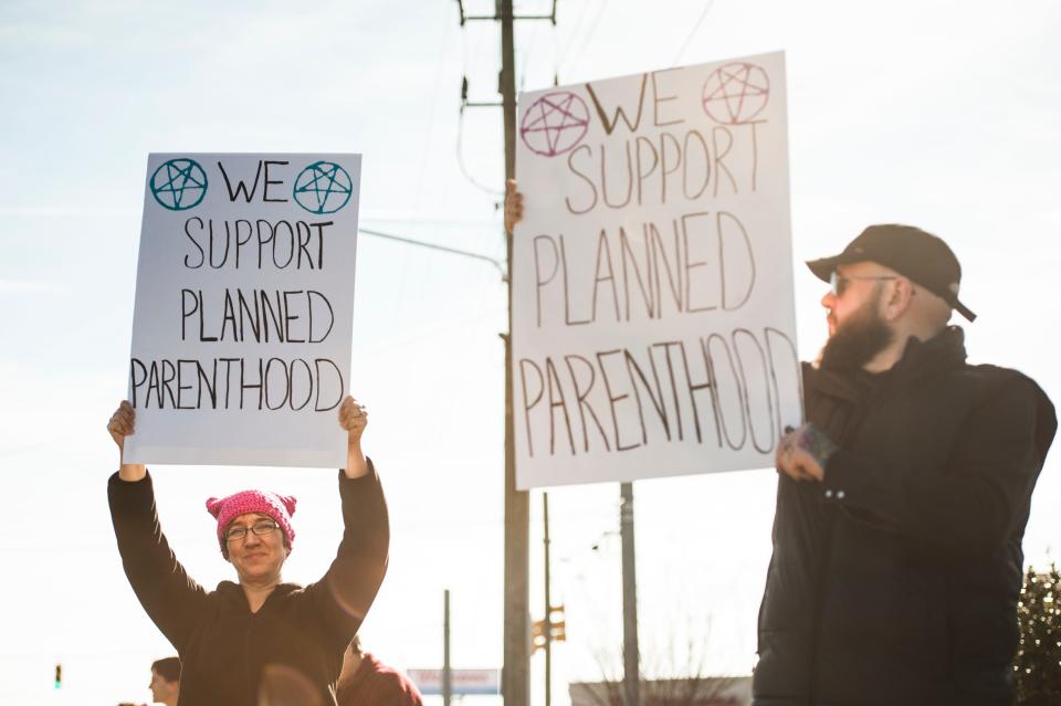 Supporters of Planned Parenthood display signs next to an organized group of demonstrators that rallied against abortion practices in front of the Planned Parenthood offices Saturday, Feb. 11, 2017. on Yadkin Road.