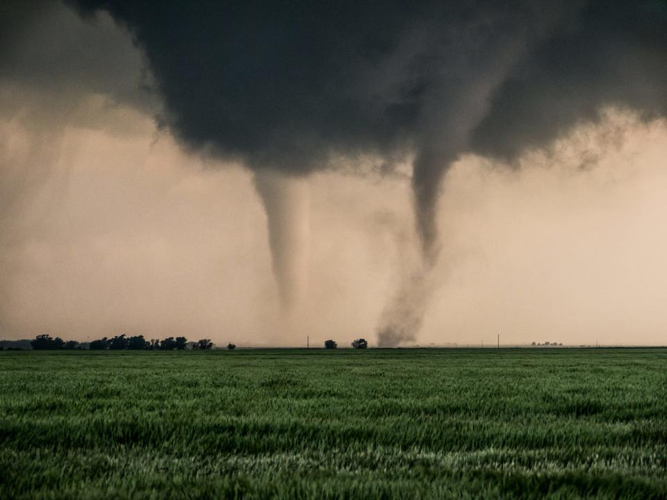 two tornadoes touching down on field in oklahoma