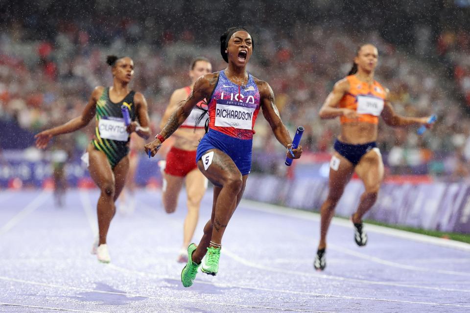 PARIS, FRANCE - AUGUST 09: Sha'carri Richardson of Team United States crosses the finish line to win the gold medals after competing in the Women's 4x100m Relay Final on day fourteen of the Olympic Games Paris 2024 at Stade de France on August 09, 2024 in Paris, France. (Photo by Hannah Peters/Getty Images)