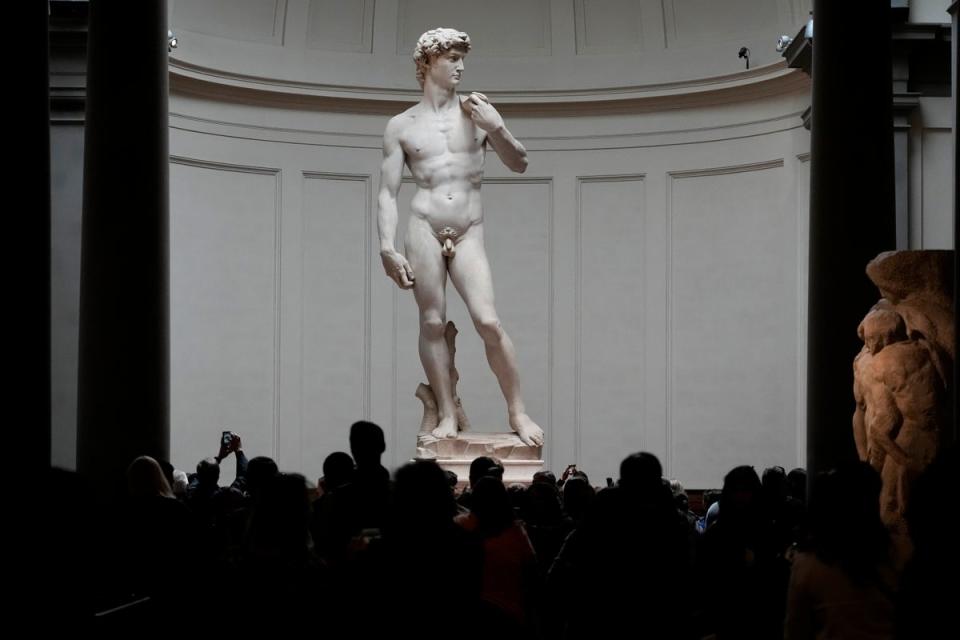 Visitors stand in front of Michelangelo’s David statue in the Accademia Gallery in Florence, Italy (Copyright 2023 The Associated Press. All rights reserved)