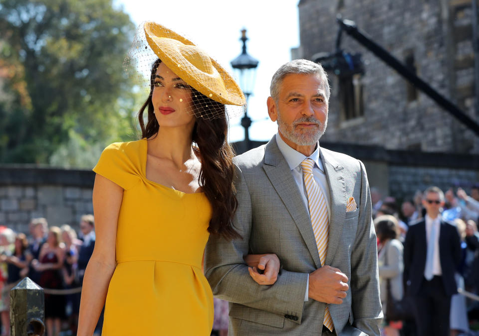 WINDSOR, UNITED KINGDOM - MAY 19:  Amal Clooney and George Clooney arrive at St George's Chapel at Windsor Castle before the wedding of Prince Harry to Meghan Markle on May 19, 2018 in Windsor, England. (Photo by Gareth Fuller - WPA Pool/Getty Images)