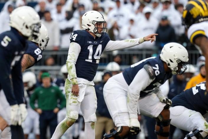 Nov 13, 2021; University Park, Pennsylvania, USA; Penn State Nittany Lions quarterback Sean Clifford (14) gestures from the line of scrimmage during the fourth quarter against the Michigan Wolverines at Beaver Stadium. Michigan defeated Penn State 21-17. Mandatory Credit: Matthew OHaren-USA TODAY Sports