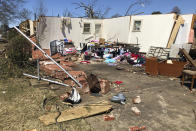 Debris covers the ground around damaged homes in Wynne, Ark., on Saturday, April 1, 2023. Unrelenting tornadoes that tore through parts of the South and Midwest that shredded homes and shopping centers. (AP Photo/Adrian Sainz)