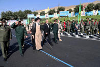 In this picture released by the official website of the office of the Iranian supreme leader, Supreme Leader Ayatollah Ali Khamenei, third left, reviews a group of armed forces cadets during their graduation ceremony accompanied by commanders of the armed forces, at the police academy in Tehran, Iran, Monday, Oct. 3, 2022. Khamenei responded publicly on Monday to the biggest protests in Iran in years, breaking weeks of silence to condemn what he called “rioting” and accuse the U.S. and Israel of planning the protests. (Office of the Iranian Supreme Leader via AP)