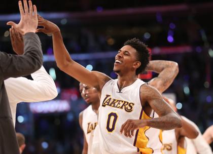 Nick Young celebrates, as is his wont. (Stephen Dunn/Getty Images)