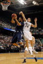 GREENSBORO, NC - MARCH 16: Andre Walker #54 of the Xavier Musketeers goes up for a shot against Pat Connaughton #24 of the Notre Dame Fighting Irish in the second half during the second round of the 2012 NCAA Men's Basketball Tournament at Greensboro Coliseum on March 16, 2012 in Greensboro, North Carolina. (Photo by Mike Ehrmann/Getty Images)