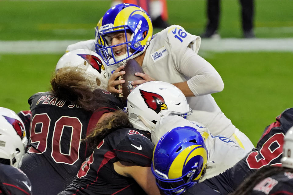 Los Angeles Rams quarterback Jared Goff (16) scores a touchdown against the Arizona Cardinals during the second half of an NFL football game, Sunday, Dec. 6, 2020, in Glendale, Ariz. (AP Photo/Rick Scuteri)