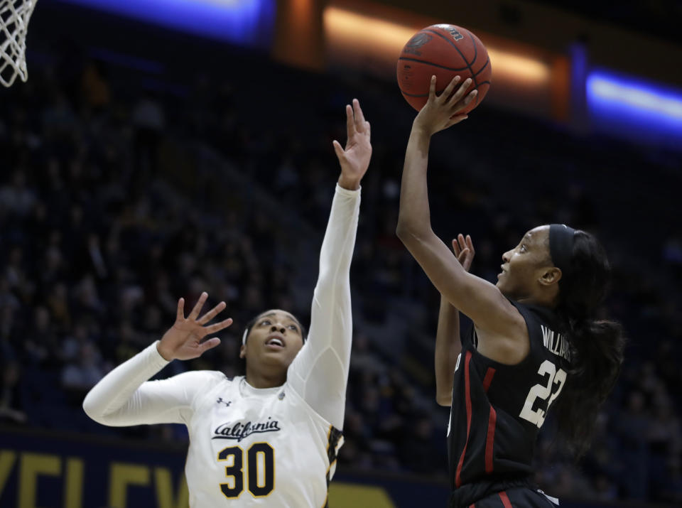 Stanford's Kiana Williams, right, shoots against California's CJ West (30) in the first half of an NCAA college basketball game Sunday, Jan. 12, 2020, in Berkeley, Calif. (AP Photo/Ben Margot)
