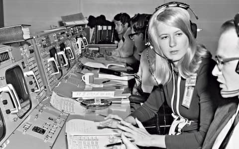 Poppy Northcutt, pictured at Nasa's Mission Control 1969, helped to design the trajectories for Apollo 11's return to Earth  - Credit: GETTY IMAGES