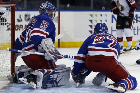 Nov 19, 2017; New York, NY, USA; New York Rangers goalie Henrik Lundqvist (30) makes a save against the Ottawa Senators during the third period at Madison Square Garden. Adam Hunger-USA TODAY Sports