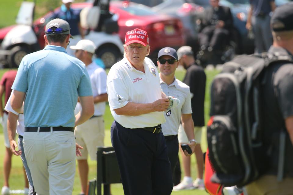 Bedminster, NJ August 9, 2023 -- LIV player Bryson DeChambeau with former President Donald Trump on the driving range as he played at Trump National in Bedminster before the weekend’s LIV Golf Tournament.