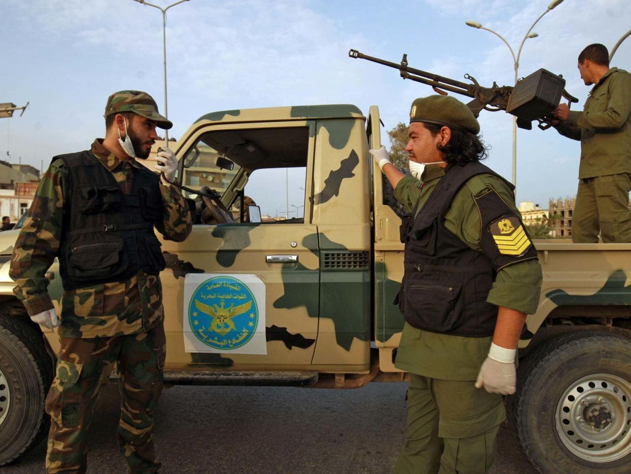 Fighters of a military battalion loyal to Libyan General Khalifa Hafta patrol the streets in the eastern city of Benghazi: AFP