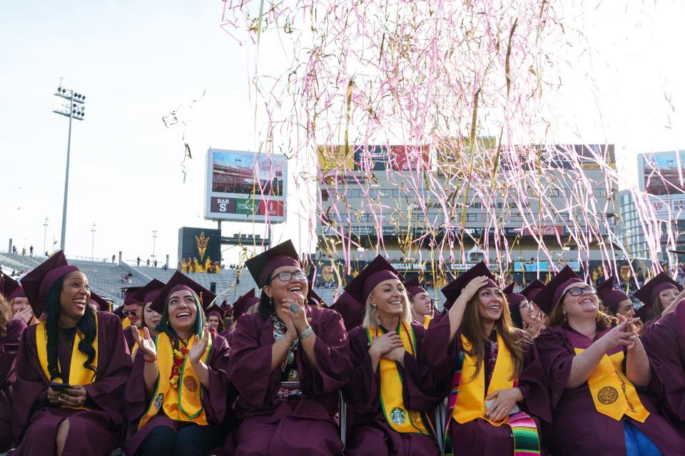 Confetti canons go off over the graduates as Arizona State University's Fall 2023 Undergraduate Commencement ends at Mountain America Stadium on Dec. 11, 2023, in Tempe.