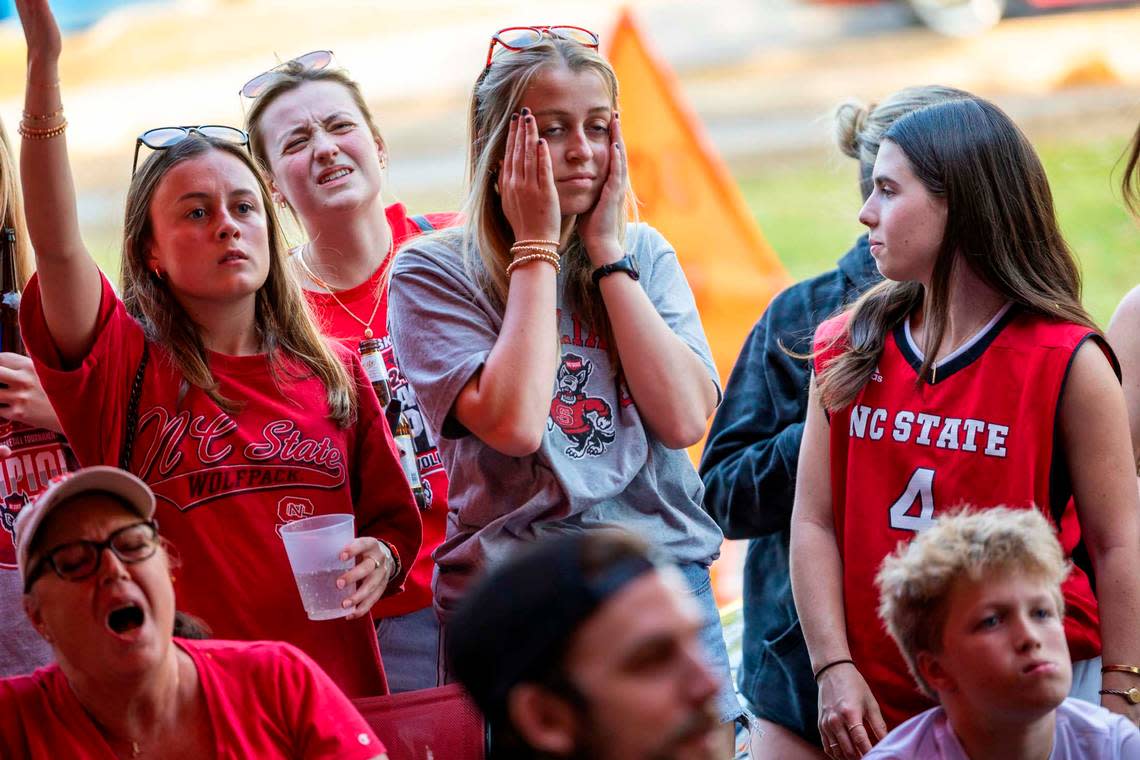 NC state fans at Players’ Retreat in Raleigh react as Duke takes an early lead against the Wolfpack lduring the first half of the Elite Eight round of the NCAA Men’s Division I Basketball Tournament on Sunday, March 31, 2024.