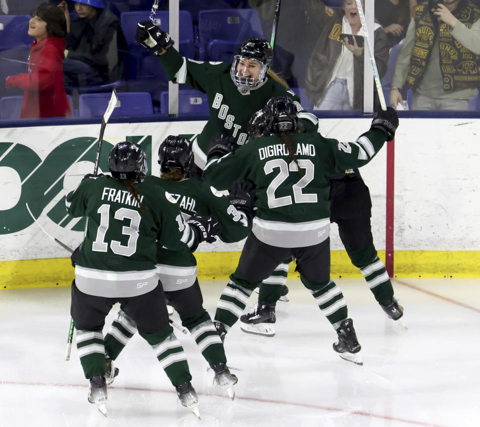 Boston forward Susanna Tapani, rear, celebrates her overtime goal against Montreal in a PWHL playoff hockey game Tuesday, May 14, 2024, in Lowell, Mass. (AP Photo/Mark Stockwell)