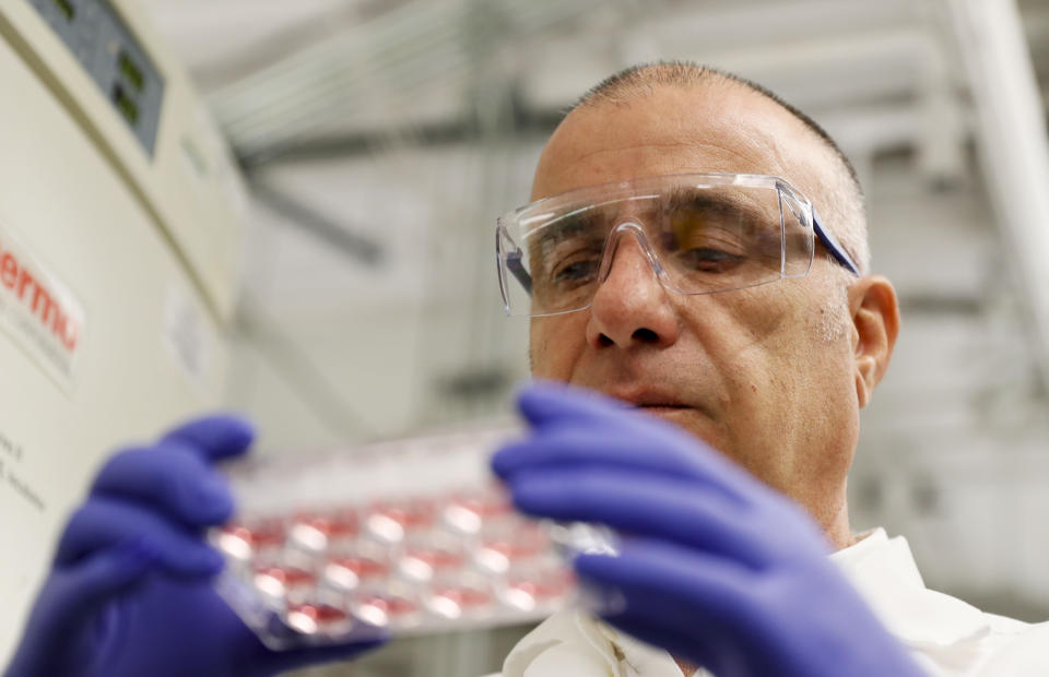 Farshad Guirakhoo, Chief Scientific Officer at Smyrna-based GeoVax, checks on one of the vaccine candidates for COVID - 19 that his lab is working on in Smyrna, Ga. on March 17, 2020. The vaccines, while not harmful, contain snippets of COVID - 19 virus DNA. At least a half-dozen efforts are underway in Georgia to research, develop treatments and vaccines for COVID - 19 which currently does not have an FDA approved treatment or vaccine. (Bob Andres/Atlanta Journal-Constitution via AP)
