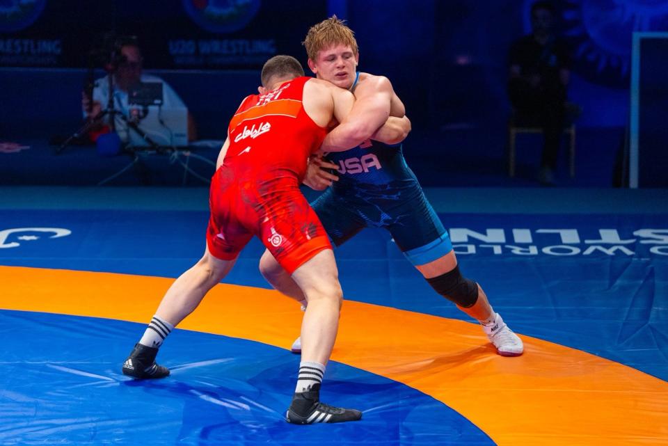 Camden McDanel, right, a 2023 graduate of Teays Valley, competes against Iran's Abolfazl Babaloo during a U20 World Freestyle Championships semifinal Monday in Amman, Jordan. McDanel dropped a 5-1 decision but battled back to finish third at 97 kilograms (approximately 214 pounds).