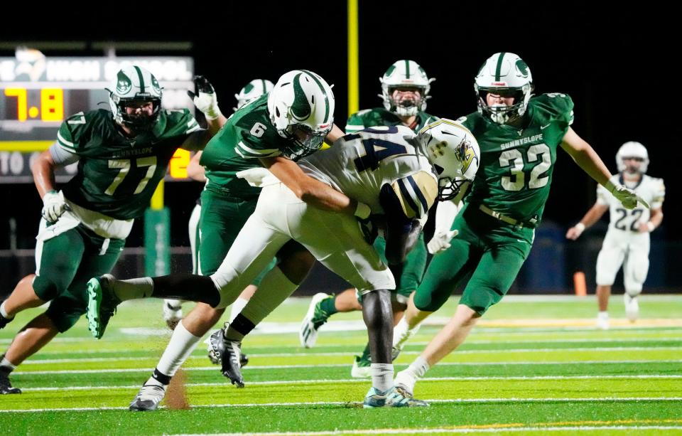 Sep 9, 2022; Phoenix, Arizona, USA; Apollo Hawks running back Adam Mohammed (24) is tackled by Sunnyslope Vikings Matthew Vera (6) during a game at Sunnyslope High. Mandatory Credit: Rob Schumacher-Arizona Republic