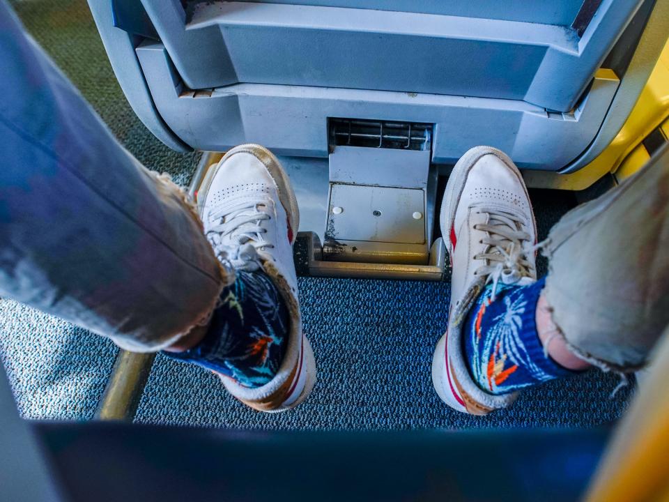 The author rests her feet on the foot rest