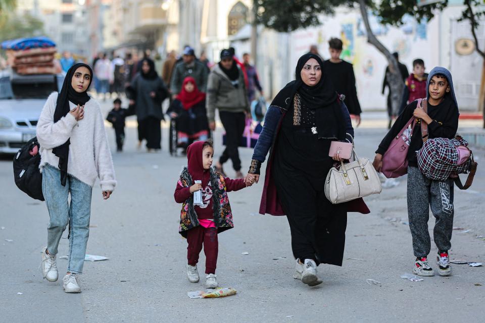 Residents of the refugee camp of Bureij arrive in Deir al-Balah in the central Gaza Strip following an evacuation order, on Dec. 22, 2023, amid the ongoing conflict between Israel and the Palestinian militant group Hamas.