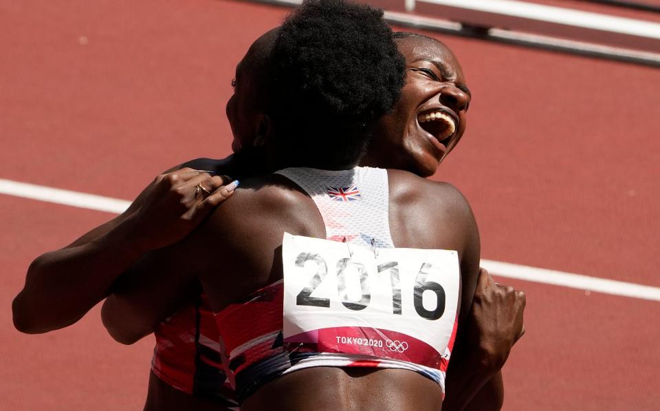 Dina Asher-Smith and Daryll Neita celebrate GB's performance in the 4x100m heats - AP