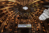 Portraits of victims of the communist rule decorate the ceiling of Bunk'Art2, an anti-nuclear shelter turned museum in Tirana, Albania, Monday, Dec. 5, 2022. (AP Photo/Vadim Ghirda)