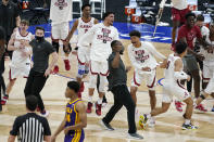Alabama players celebrate after beating LSU in the championship game at the NCAA college basketball Southeastern Conference Tournament Sunday, March 14, 2021, in Nashville, Tenn. (AP Photo/Mark Humphrey)