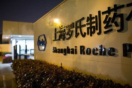 The logo of Shanghai Roche Pharmaceutical Co. Ltd. is seen outside their headquarters in Shanghai May 22, 2014. REUTERS/Aly Song