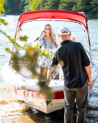 <p>Rachel Stanley Photography</p> Ali Taylor arrives by boat to the island where fiancé Gary Wayne proposed.