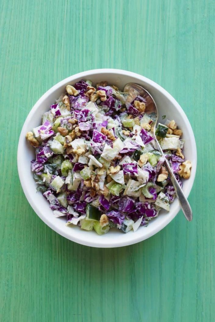 <p><strong>Then: </strong>The original recipe called for shredded green cabbage. Previously, this coleslaw was topped with toasted slivered almonds. The dressing in the 1960s version used a hefty combination of mayonnaise and heavy cream.</p><p><strong>Now: </strong>We added purple cabbage for color and chopped the ingredients for better crunch. We traded the almonds for walnuts and added a chopped apple for a twist on the classic Waldorf salad. To lighten things up, we cut back on the mayo, swapped the heavy cream for sour cream and added zip with horseradish.</p><p><a rel="nofollow noopener" href="http://www.womansday.com/food-recipes/recipes/a50562/crunchy-coleslaw-recipe-wdy0615/" target="_blank" data-ylk="slk:Get the recipe." class="link rapid-noclick-resp"><strong>Get the recipe.</strong></a> </p>