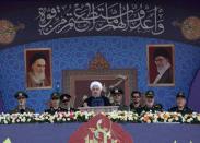 Iranian President Hassan Rouhani delivers a speech during the ceremony of the National Army Day parade in Tehran