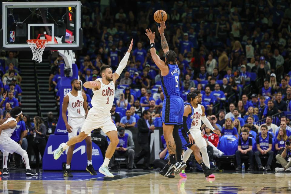 Magic forward Paolo Banchero shoots against Cavaliers guard Max Strus during the first quarter of Game 3 of the first round of the NBA playoffs, April 25, 2024, in Orlando.