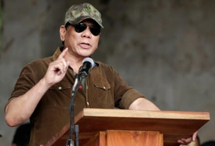 Philippine President Rodrigo Duterte gestures while delivering a speech during his visit at Bangolo town, Marawi city, southern Philippines October 17, 2017. REUTERS/Stringer  NO RESALES. NO ARCHIVE - RC1DF73BF6A0