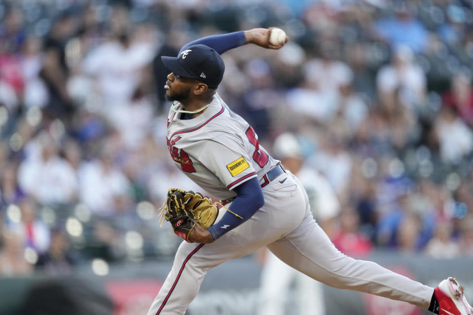 Atlanta Braves starting pitcher Darius Vines works against the Colorado Rockies during the first inning of a baseball game Wednesday, Aug. 30, 2023, in Denver. (AP Photo/David Zalubowski)