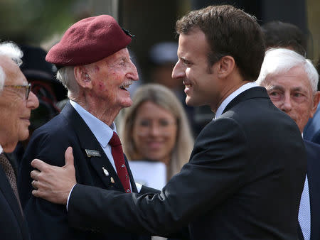 French President Emmanuel Macron presents the Legion d'Honneur award to Australian war veteran William Mackay during a Commemorative Service at the Anzac war memorial in Sydney May 2, 2018. AAP/Rick Rycroft/Pool via REUTERS