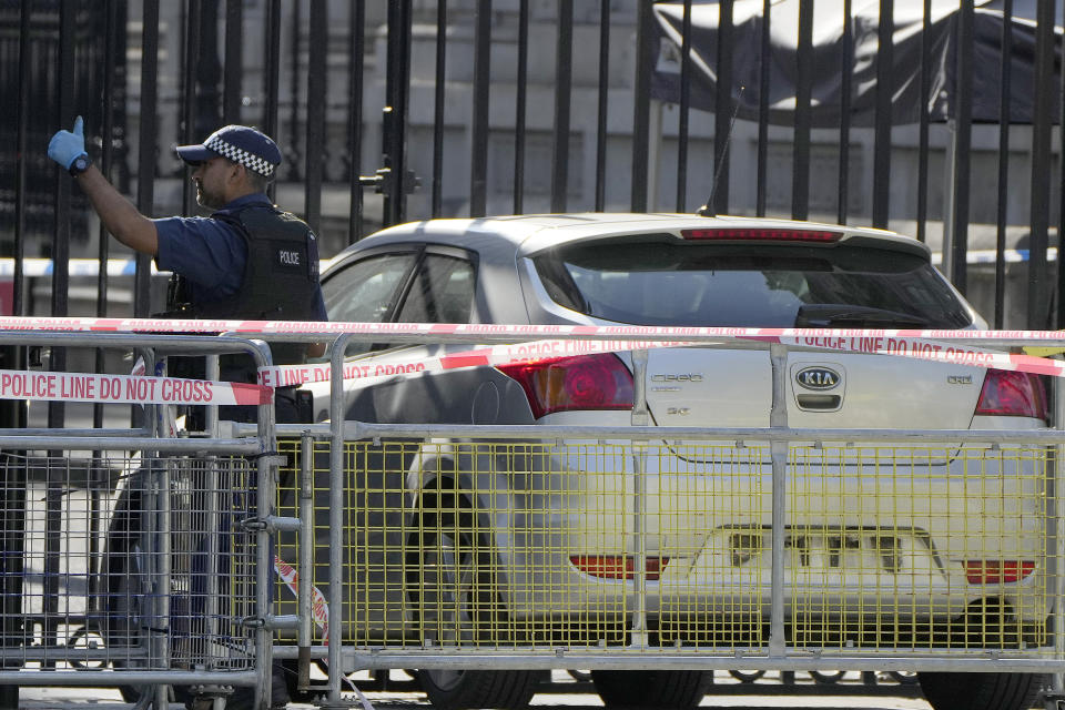 Police at the scene after a car collided with the gates of Downing Street in London in London, Thursday, May 25, 2023. Police say a car has collided with the gates of Downing Street in central London, where the British prime minister's home and offices are located. The Metropolitan Police force says there are no reports of injuries. Police said a man was arrested at the scene on suspicion of criminal damage and dangerous driving. It was not immediately clear whether the crash was deliberate. (AP Photo/Alastair Grant)