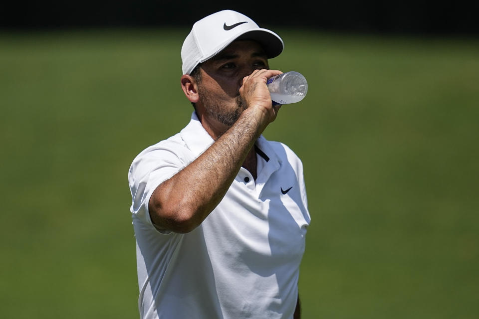 Jason Day drinks water on the first fairway during the third round of the Tour Championship golf tournament, Saturday, Aug. 26, 2023, in Atlanta. (AP Photo/Mike Stewart)