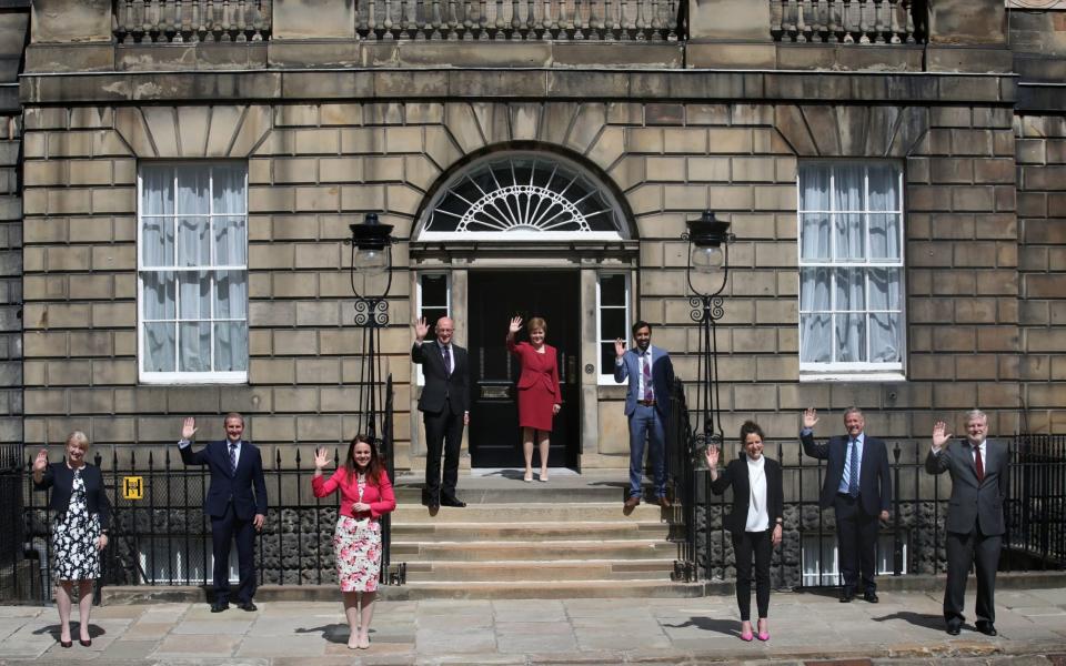 First Minister Nicola Sturgeon stands on the steps of Bute House in Edinburgh alongside her newly formed Cabinet -  Andrew Milligan/PA