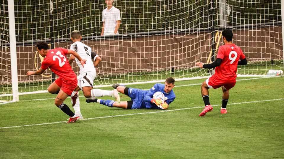 Western Michigan University goalkeeper Hunter Morse makes a save against Northern Illinois earlier this season. Morse is a 2017 graduate of New Boston Huron and a graduate transfer from Michigan State University.