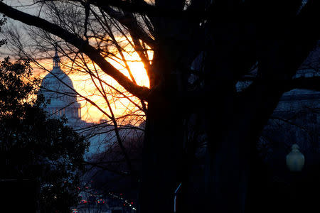 The sun rises over the U.S. Capitol in Washington, U.S. February 8, 2018. REUTERS/Jonathan Ernst