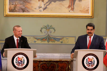 Turkish President Tayyip Erdogan and Venezuela's President Nicolas Maduro attend a news conference after an agreement-signing ceremony between Turkey and Venezuela at Miraflores Palace in Caracas, Venezuela December 3, 2018. REUTERS/Manaure Quintero