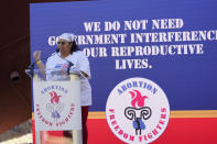 Michelle Colon, co-founder and executive director of SHERO, reminds the audience that the government "need not interfere in the reproductive lives of women," during an abortion rights rally in Smith Park in Jackson, Miss., Wednesday, Dec. 1, 2021. The U.S. Supreme Court on Wednesday heard a Mississippi case that directly challenges the constitutional right to an abortion established nearly 50 years ago. (AP Photo/Rogelio V. Solis)