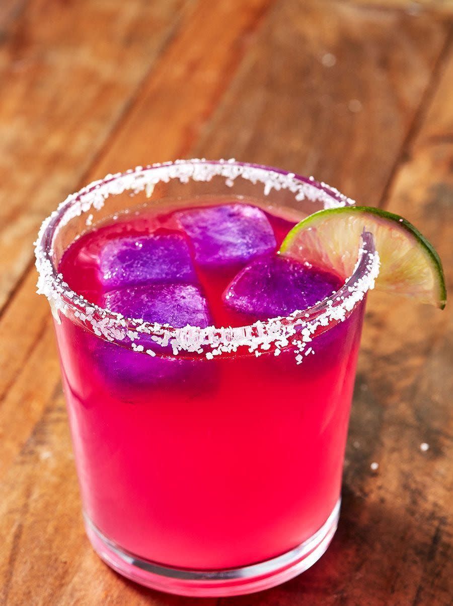 <p>The secret ingredient in these mysterious color-changing margaritas is something your Halloween guests definitely won't expect: cabbage! </p><p>Get the <strong><a href="https://www.delish.com/cooking/recipe-ideas/a27183454/color-changing-margaritas-recipe/" rel="nofollow noopener" target="_blank" data-ylk="slk:Color-Changing Margaritas recipe;elm:context_link;itc:0;sec:content-canvas" class="link ">Color-Changing Margaritas recipe</a> </strong>from Delish. </p>