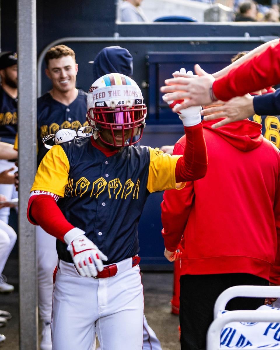 WooSox infielder Enmanuel Valdez receives high-fives in the first inning after he hit a home run in Worcester's 4-2 win over the Lehigh Valley IronPigs on Friday.