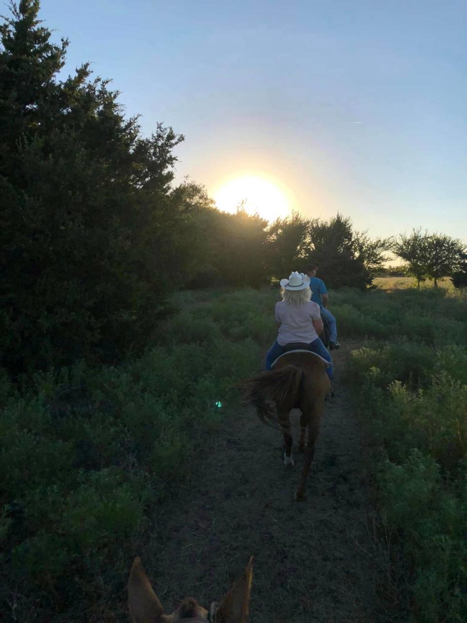 Amy Woodworth and family taking a sunset ride at Flying G Ranch.